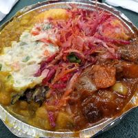 A medium lunch - seitan, chickpeas, cornmeal plus potatoes and salad at Vegan's Delight in Bronx