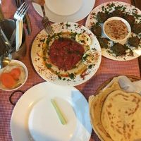 Hummus bowl, falafel, breads and pickles. at Hummusbar in Tbilisi