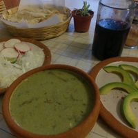 vegan soup with extra avocado, comes with salad bits and crisp bread at Cabuche in Oaxaca