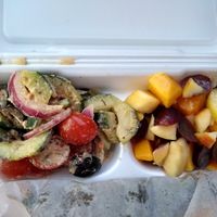 Cucumber and tomato salad and seasonal fruit at Plant Power Cafe & Juice Bar in Chattanooga