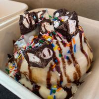 Cinnamon roll with marshmallow frosting, s’mores cups and rainbow sprinkles  at Cinnaholic in Richardson