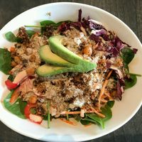 Buddha Bowl: Radicchio, spinach, carrot, red pepper,  poppyseed, walnut,  quinoa + chickpea salad topped with avocado and a siracha tahini sauce  at Field & Fire Cafe in Grand Rapids