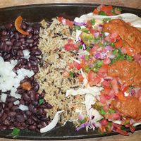 Crispy beer battered avocado tacos platter with black beans and wild rice at Nacho Daddy - The Strip in Las Vegas