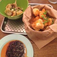 Fried dumplings and fried tofu with the gao chilli sauce in the plate. at GAO Dumpling Bar in Copenhagen