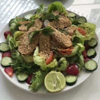 Delicious salad with tempeh and a little kick of curry in the dressing - YUM  at Ama Vegan Kitchen in Chiang Mai