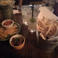 Homemade ginger ale, marinated olives, nachos,  and french fries at Zest Cantina - Odaiba in Tokyo