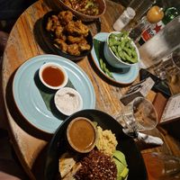 Peanut tofu stir fry on the left, with cauli wings and edamame, I had the Buddha bowl on the right, but it wasn't as good as everything else as it was a lot of raw stuff! at The Banyan Tree in 