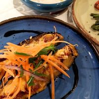 Baked eggplant with vegan cheese and fresh vegetables. Part of vegan meze in Windmill, 2021. at Windmill Restaurant in Paphos