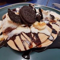 pancake with vegan yoghurt, cholocate sauce and oreos  at KAFETHEA in Maastricht
