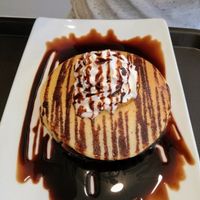 Pancakes with pears and chocolate sauce. at Tweny Leaf in Lisbon