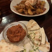 the sausage dish and the patatas bravas   at La Tavernaire in Valencia