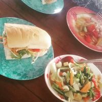 Tofu burger and a mixed veg dish at Number One Vegetarian in Bangkok