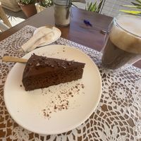 Chocolate cake and oatmilk cappuccino 😍  at PurEssence in Alvor