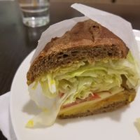 La moitié du petit sandwich, délicieux à 180, en bas à droite de la carte at Tomson Coffee in Tainan