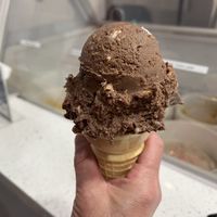 Single scoop of their rocky road ice cream on a cake cone  at Hug Life in Garden Grove