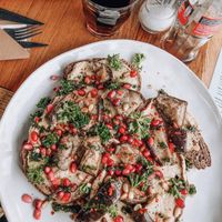 Bread with aubergine, hummus, pesto and pomegranade at ROOS Taste and Smile in Leiden