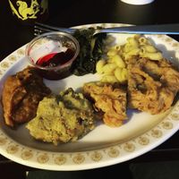 Clockwise from top: cranberry sauce, greens, mac and cheese, chick'n, dressing, sweet potatoes. All delish! at The Southern V in Nashville