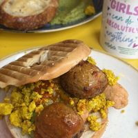 Ultimate vegan breakfast bagel with scrambled tofu, sausage and potato  at Nibble Cafe in Manchester