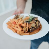 This was one of the less burnt pieces of wellington. Also, note the huge pile of boiled carrots we didn't ask for. at Vegan Food Pimp in Brighton