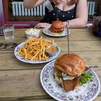 Chicken burger with blue cheese fries and coleslaw at Lia's Kitchen in Berlin