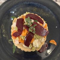 Antipasto: Crostatina con ricotta di anacardi e la nostra giardiniera di stagione  at La Mi Mama in Rimini