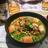 Kare Burosu curry with chunky udon noodles and crispy silken tofu, plus vegan friendly Asahi beer at Wagamama - Xscape in Milton Keynes