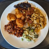 Shiitake Steak, Tempeh in Peanut Sauce, Redang Smoked Seitan, Green Quinoa with Edamame, Tempeh Salad, Corn Fried Cauliflower (clockwise from top) at Spirit in Amsterdam
