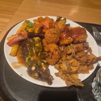 Mixed Carrots, Seitan Steak Umami Sauce, cauliflower tempura, mixed mushroom salad at Spirit in Amsterdam