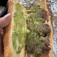 What is the green stuff on a cheesesteak? And red onions?  at Razzi's Pizzeria - Howell St in Seattle