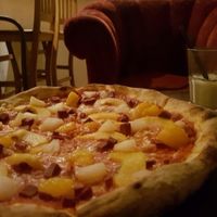 Vegan Antipodi Pizza (vegan cheese, ham, pineapple, mandarin, and peaches) with a vegan White Russian (almond milk, vodka, and kahlua) at Graciarnia in Wroclaw