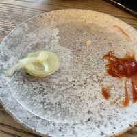 There was so much raw onion, she couldn’t eat it all 😭  at Grindz Cafe in Tauranga