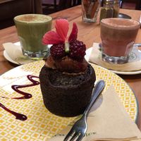 Raspberry muffin + matcha and beetroot latte with coconut milk  at Grindz Cafe in Tauranga