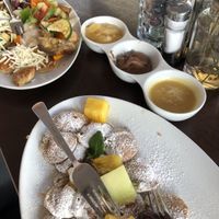 two plates with all hearty and all sweet vegan toppings   at Poffers Cafe in Stuttgart