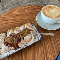 Vegane Poffers mit Pflaumenmus und Cappuccino mit Hafermilch  at Poffers Cafe in Stuttgart