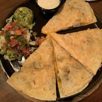 Vegan chicken quesadilla with vegan sour cream, guacamole, and pico de gallo  at Nacho Daddy - Summerlin in Las Vegas