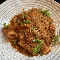 Rigatoni with a delightful sauce and gluten free breadcrumbs at Plants by Deliciously Ella in London