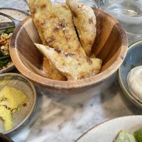 sourdough flatbread with cultured house butter  at Plants by Deliciously Ella in London