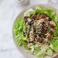 Seasonal mushroom and butter lettuce salad with sesame and chives + miso dressing on the side - yum too! at Plants by Deliciously Ella in London