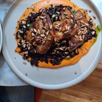 Best dish ever. Aubergine, black rice & red pepper cream. at Plants by Deliciously Ella in London