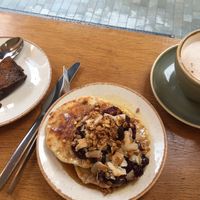Pancakes + jam and maple syrup  at Plants by Deliciously Ella in London