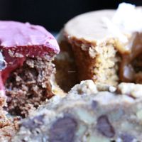 (left) vicious velvet cupcake, (right) thai tea cupcake, (front, bottom) chocolate chip cookie with walnut - all gluten free at Caked Up in Rancho Cucamonga