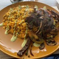 Tacu tacu con lomo saltado a base de quinoa  at Mestizo Vegano in Bogota