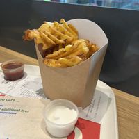 Waffle fries and vegan aioli   at AMS - LEON in Schiphol