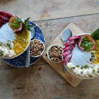 mango smoothie bowls with a side of crunchy granola :)  at Peace Food Cafe in Sihanoukville