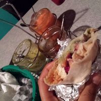end of the burrito, with sauces to compliment at Budgies Burritos in Vancouver