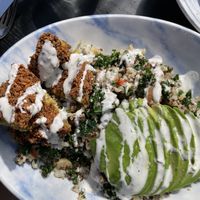 Warm grain bowl with falafel and vegan ranch  at Public Greens - 64th St in Indianapolis