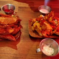 buffalo cauliflower wings and potato wedges at 90 Degree Melt in East London