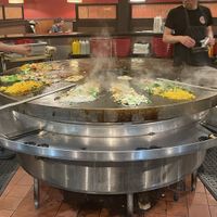Stir frying vegan food separate from meat  at Gobi Mongolian Grill in Southington