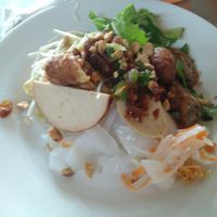 The topping is fried spring rolls, vegan sausage, vegan grilled mock meat and pickles at Tinh Duyen in Long Xuyen