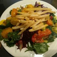 Dish of the day. Looks weird with the fries on top but they were good and the vegetables below too! at Veggie Cafe Varia in Brussels